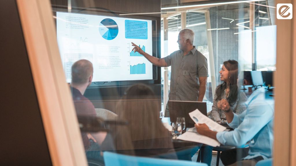 Team meeting in a conference room discussing digital marketing strategies