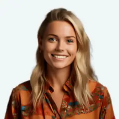 Portrait of a smiling woman with shoulder-length blonde hair wearing an orange floral blouse, facing the camera.